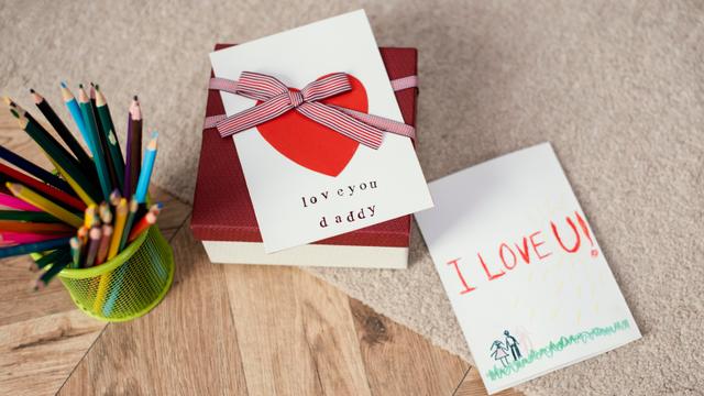 high-angle-gift-with-card-pencils-father-s-day